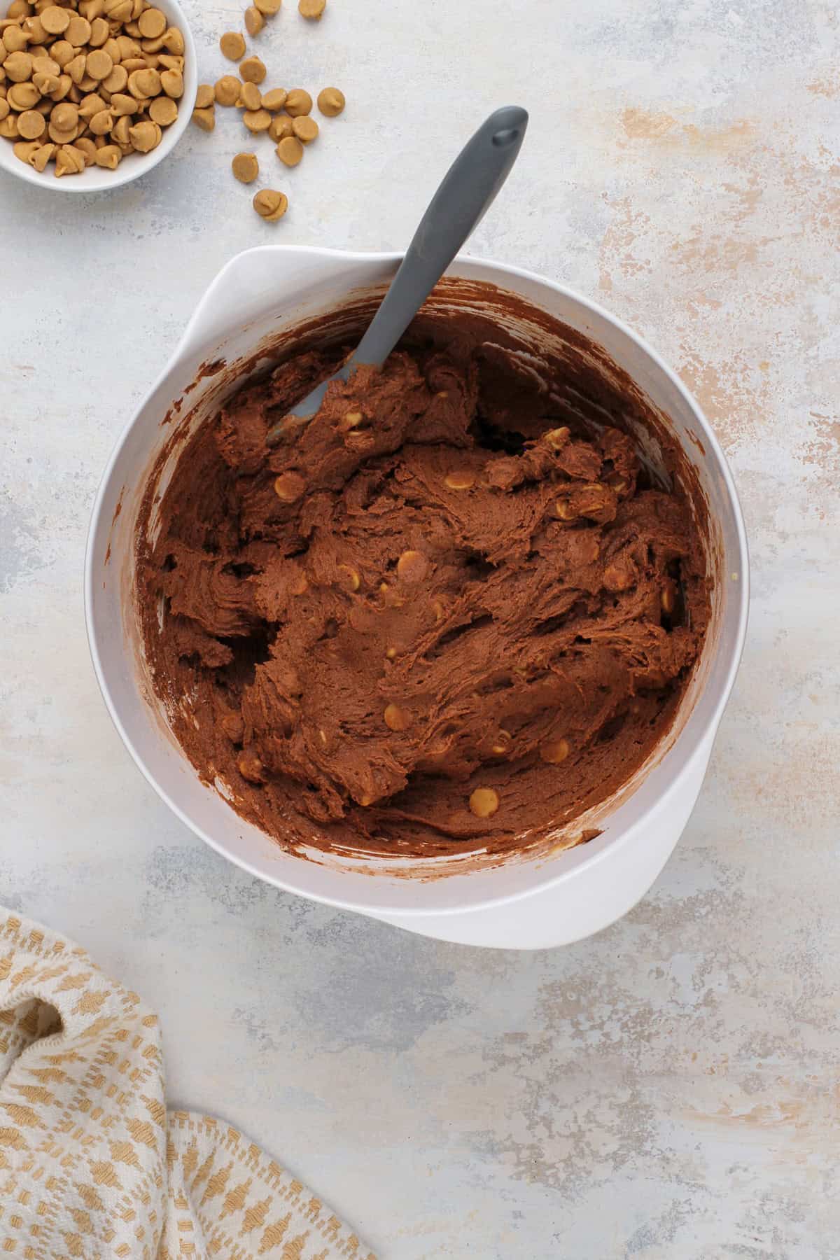 Chocolate peanut butter cookie dough mixed in a white bowl.
