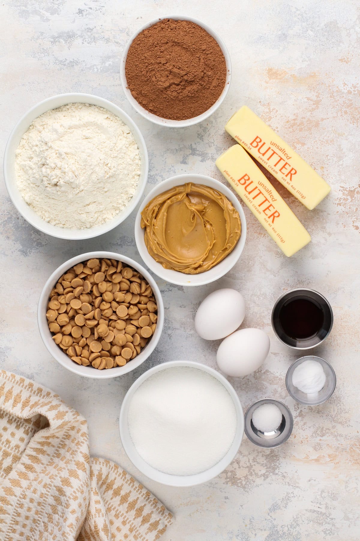 Chocolate peanut butter cookie ingredients arranged on a countertop.