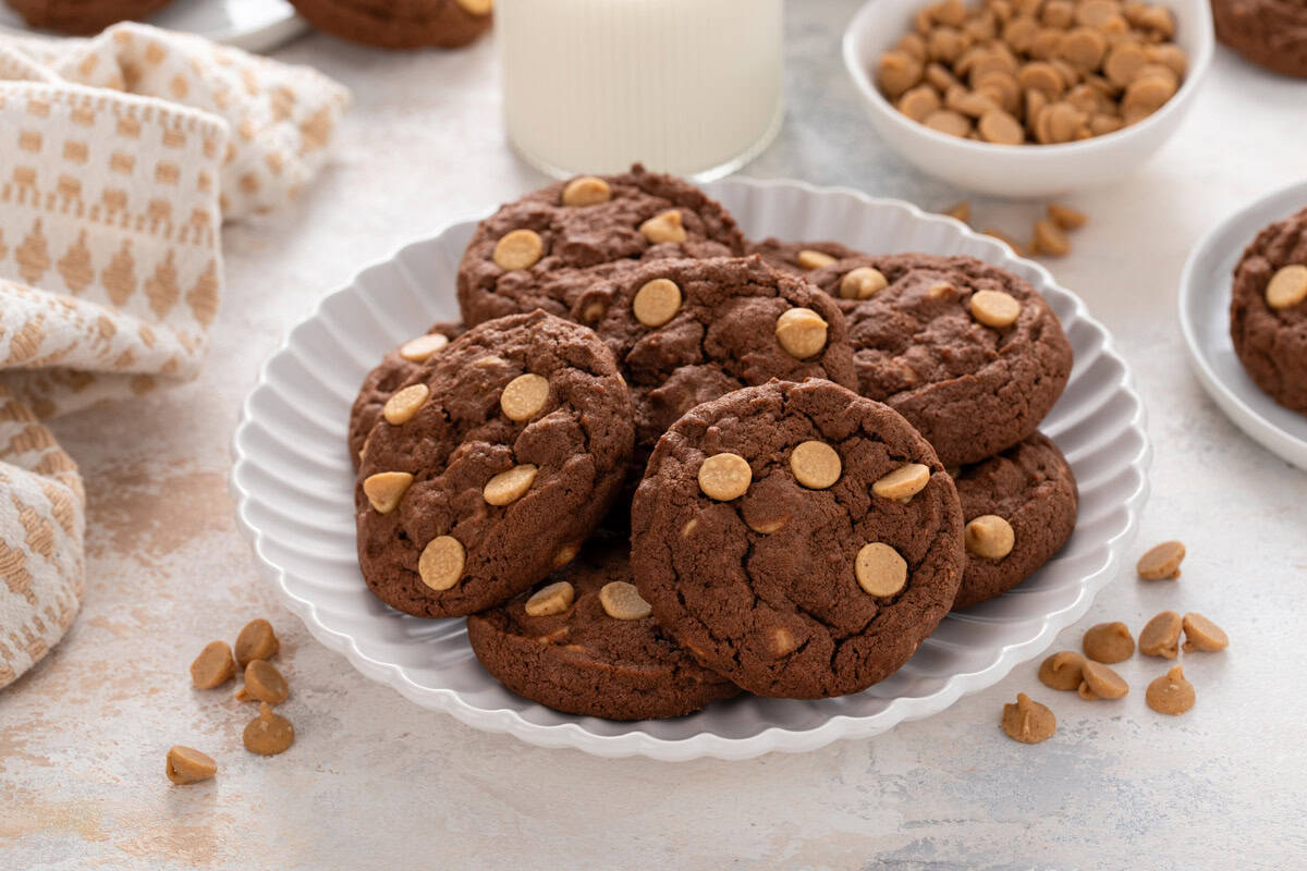 Chocolate peanut butter cookies arranged on a white platter.