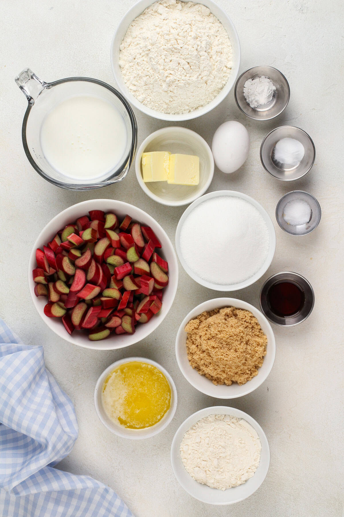 Ingredients for rhubarb streusel cake arranged on a countertop.