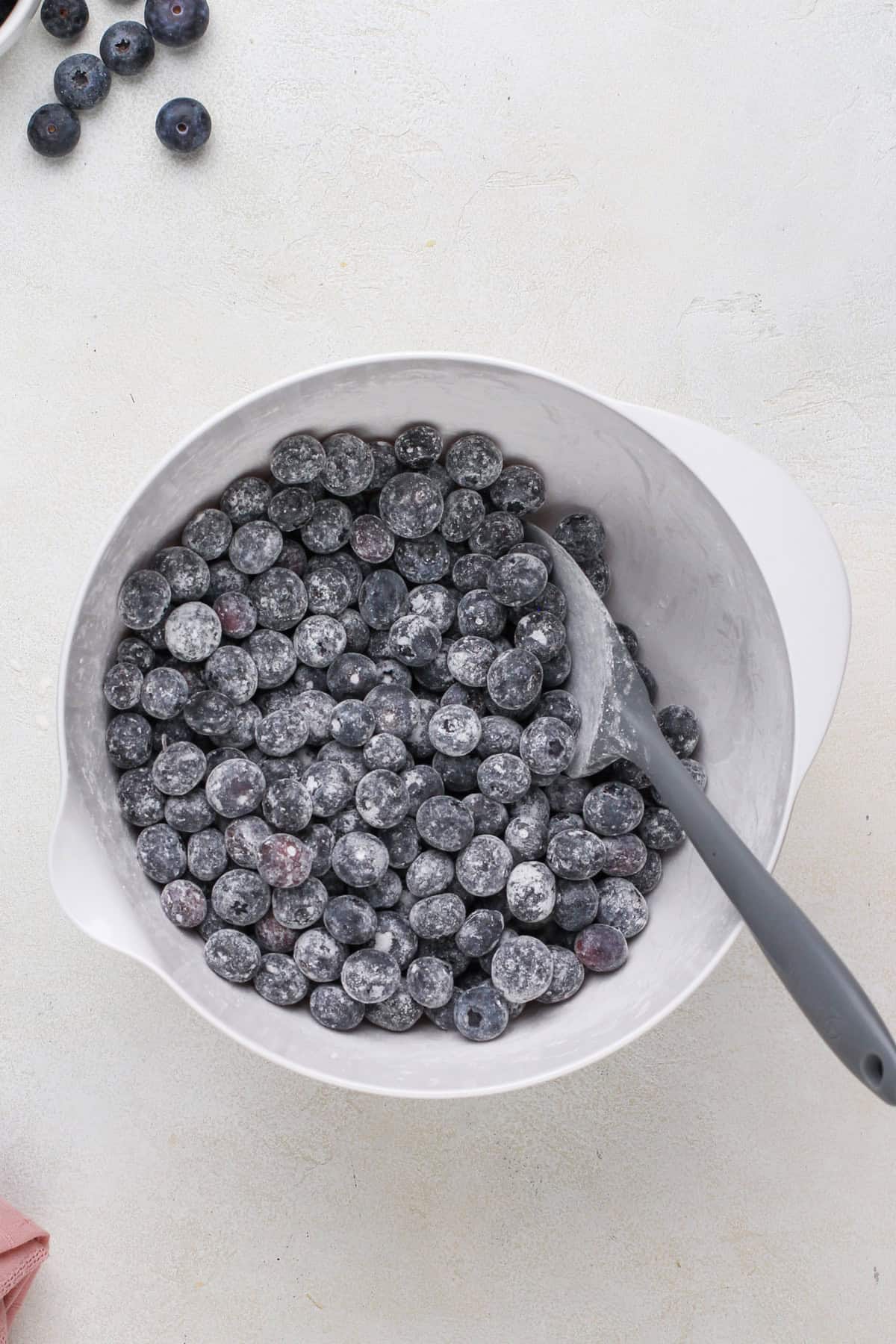 Blueberry crumb bar filling mixed in a glass bowl.