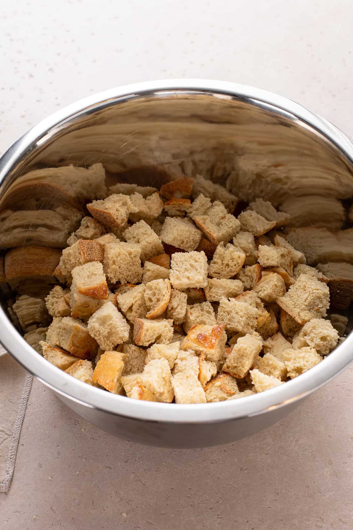 Toasted bread cubes in a large bowl.
