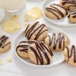 White plate filled with several potato chip cookies.