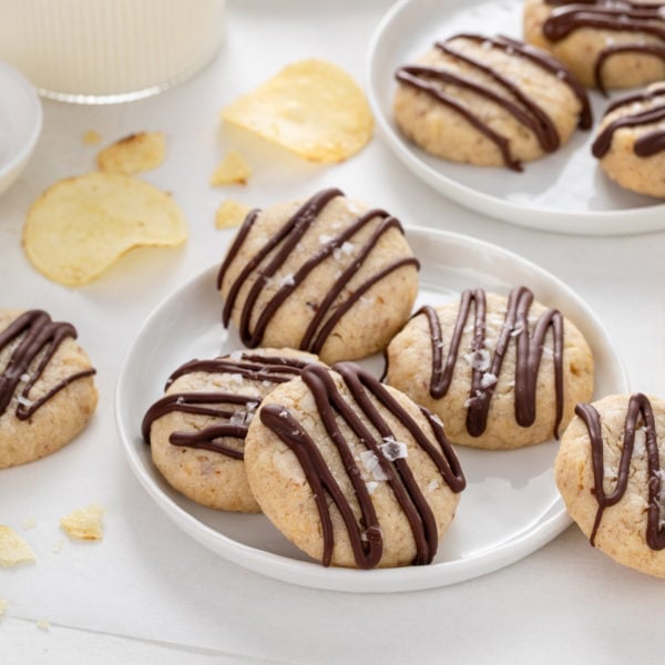 White plate filled with several potato chip cookies.
