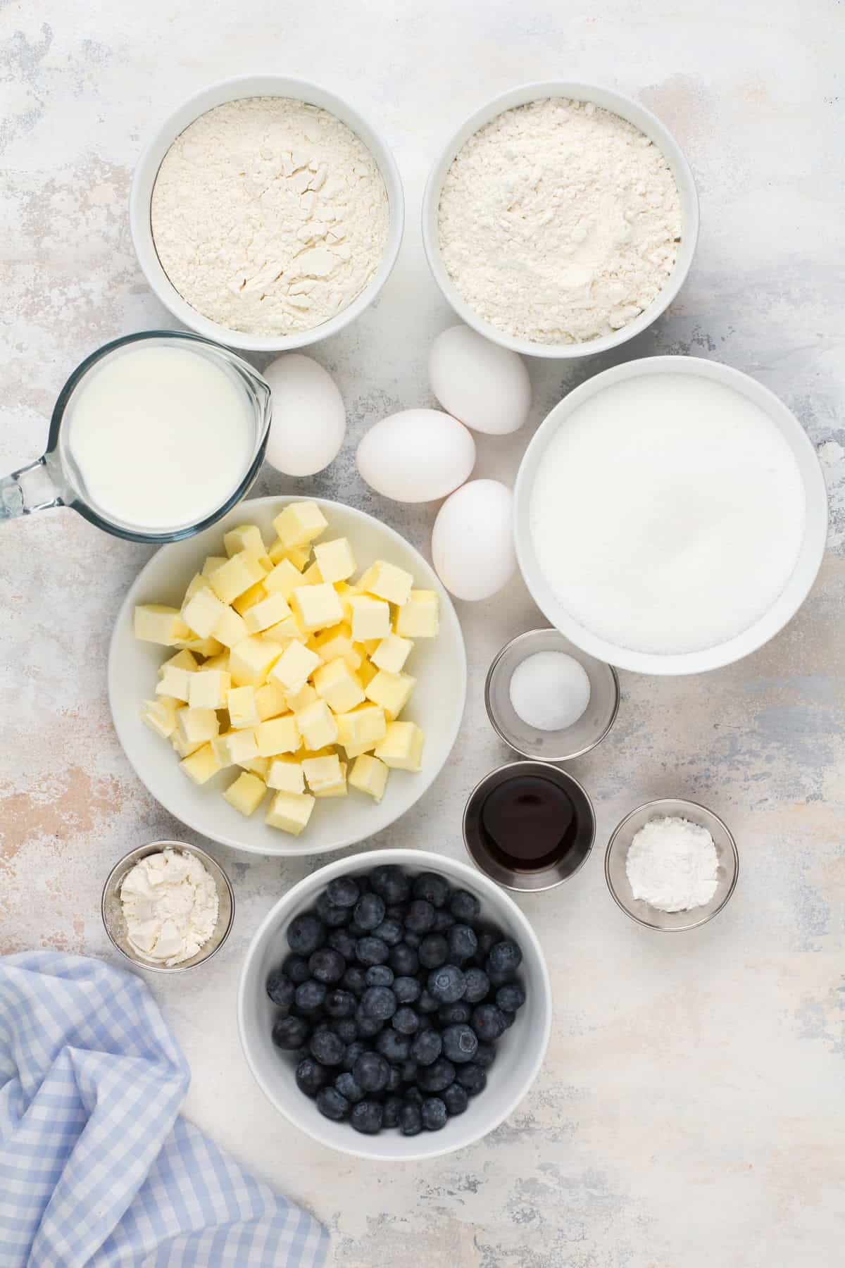 Blueberry cupcake ingredients arranged on a countertop.