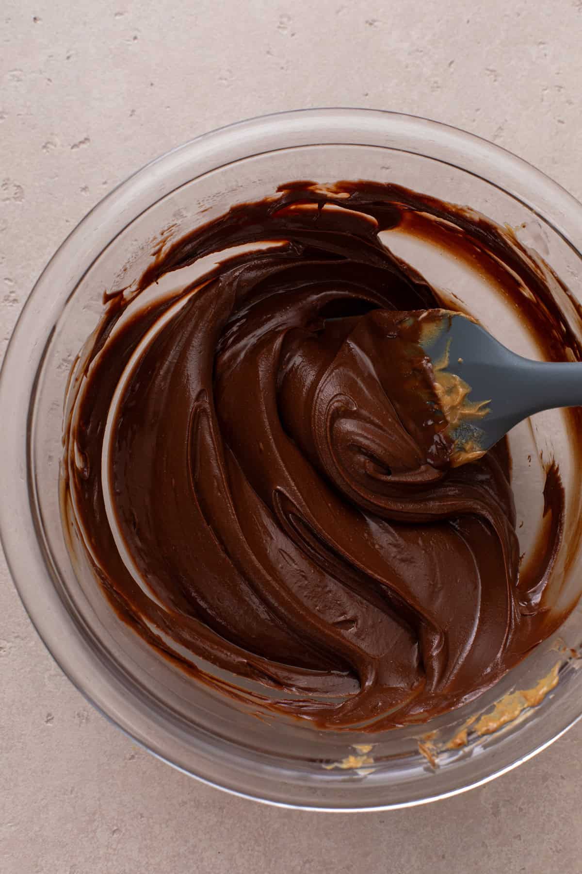 Melted chocolate and peanut butter in a mixing bowl.