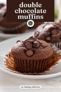 Unwrapped double chocolate muffin on a white plate. Text overlay includes recipe name.