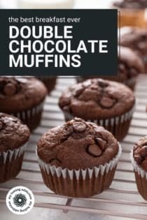 Double chocolate muffins lined up on a wire cooling rack. Text overlay includes recipe name.