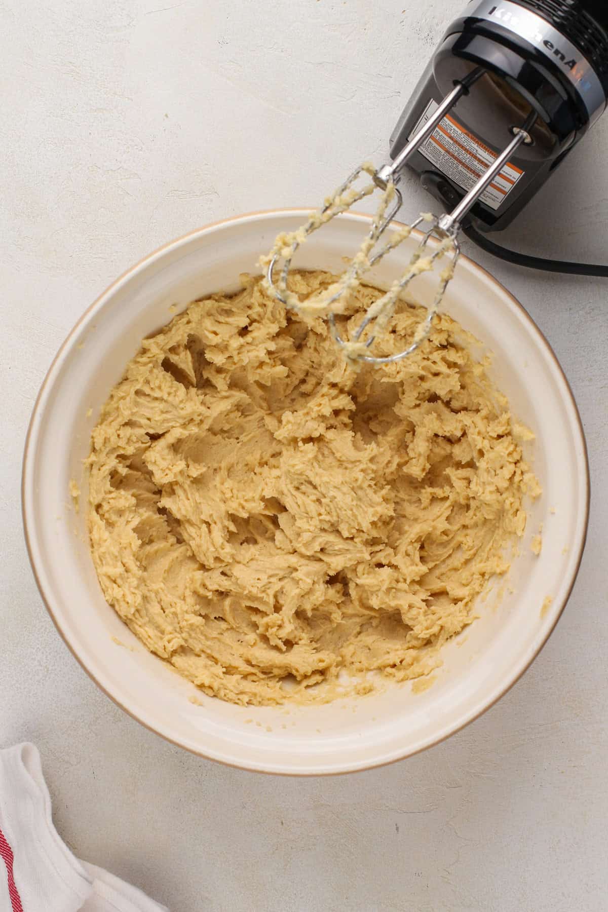 Wet ingredients for salted caramel chocolate chip cookies mixed in a mixing bowl.