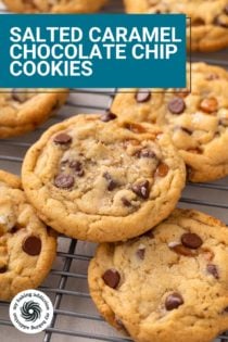 Close up of salted caramel chocolate chip cookies on a wire rack. Text overlay includes recipe name.