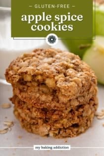 Bite taken from an apple spice cookie on the top of a stack of the cookies. Text overlay includes recipe name.