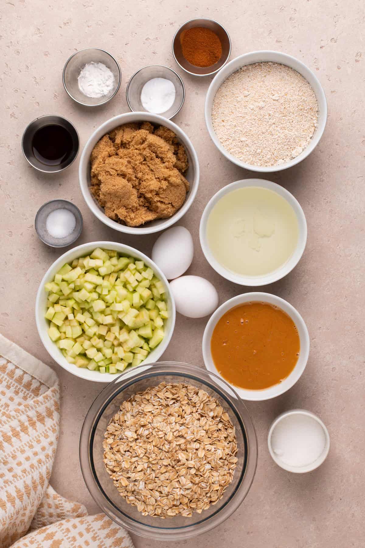 Ingredients for apple spice cookies arranged on a countertop.