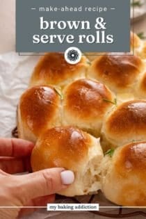 Person taking a roll from baked brown and serve rolls. Text overlay includes recipe name.