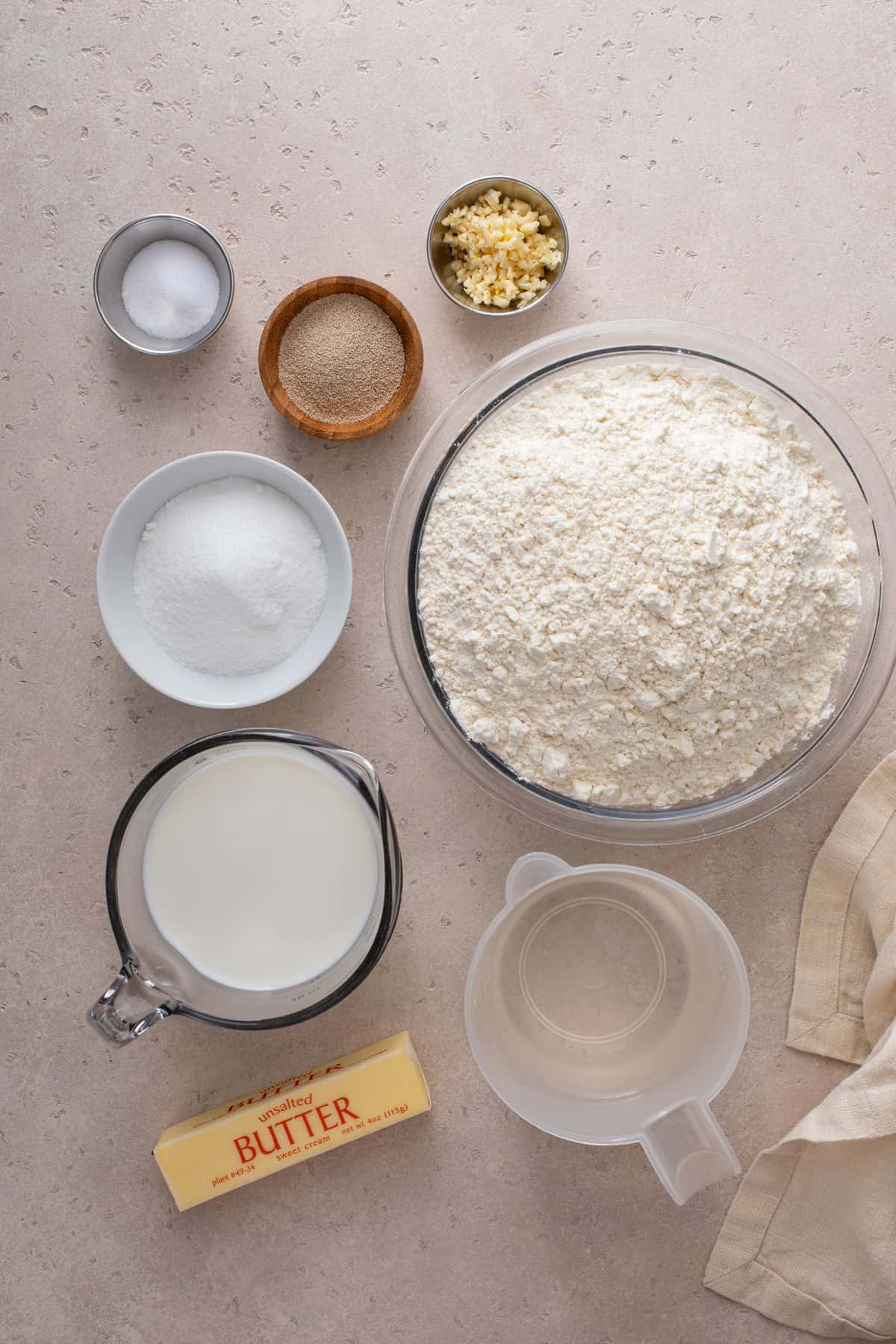 Ingredients for brown and serve rolls arranged on a countertop.
