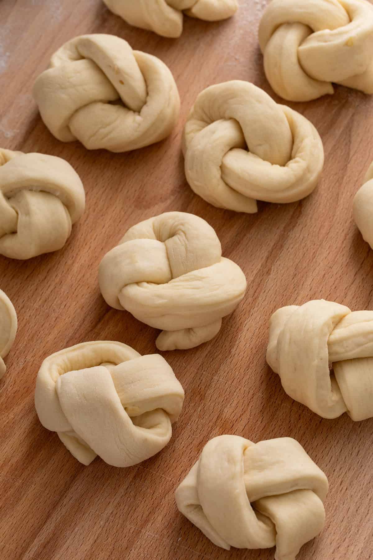 Dough shaped into bow knot rolls.