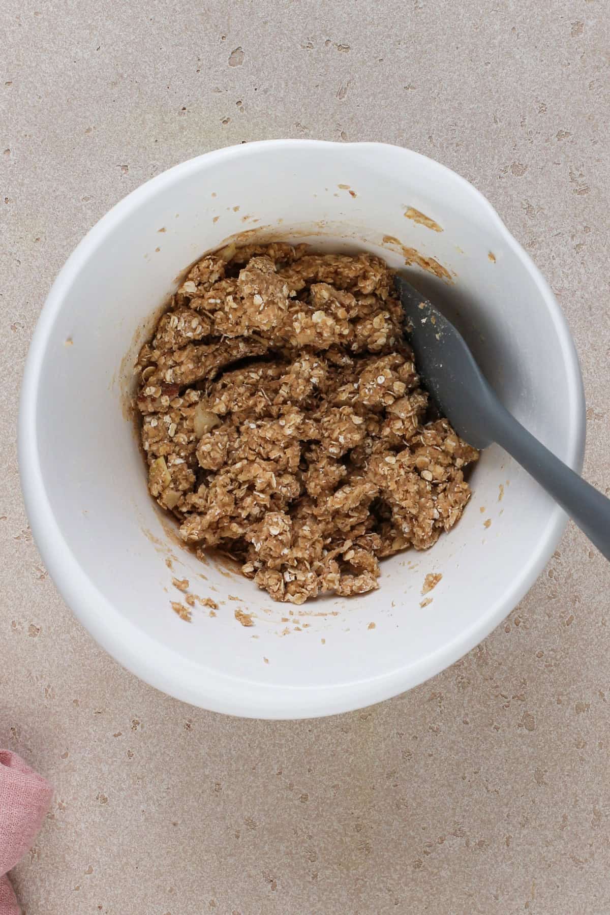 Dough for cherry cheesecake bar crust in a white bowl.