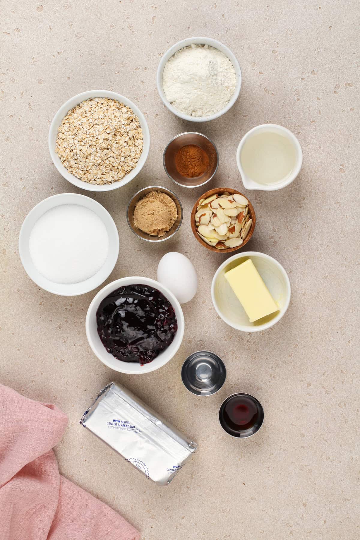 Ingredients for cherry cheesecake bars on a countertop.