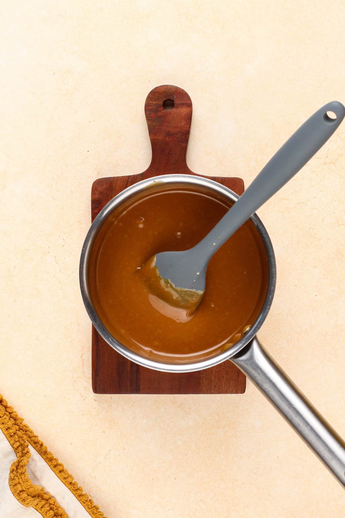 Melted caramel in a saucepan.