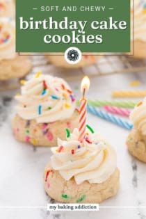 Lit birthday candle in a birthday cake cookie with more cookies in the background. Text overlay includes recipe name.