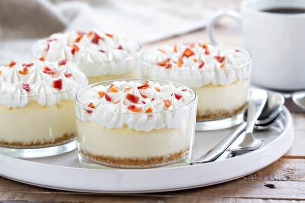Maple Bacon Cheesecakes are sweet, salty and topped with a dollop of whipped cream and candied bacon. So darn good!