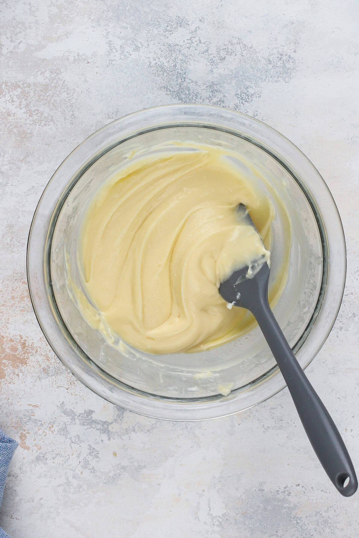 Cheesecake filling for cherry cheesecake cookies mixed in a glass bowl.