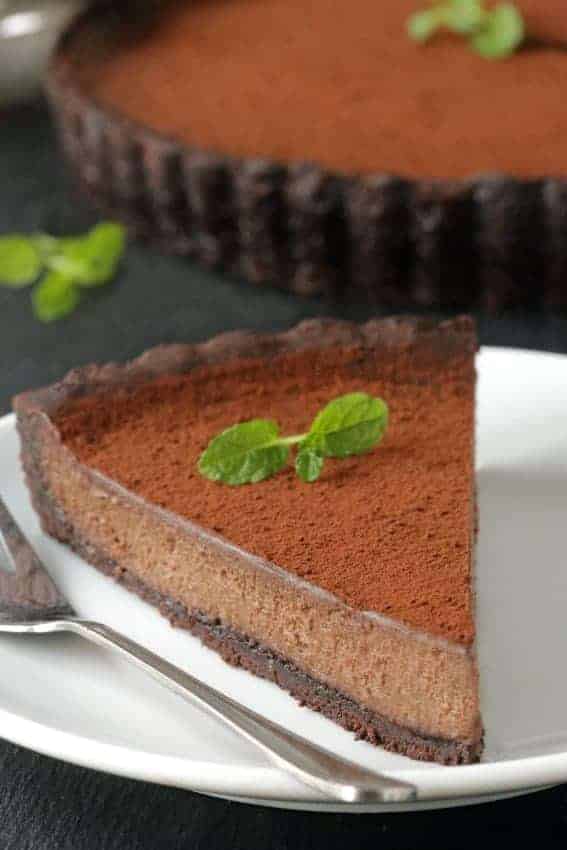 Mint Chocolate Tart has a creamy chocolate filling and homemade chocolate cookie crust. So delicious. Recipe includes a gluten-free option.