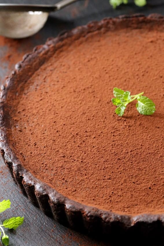 Mint Chocolate Tart is rich, decadent and full of mint flavor. So great for the holidays! Recipe includes a gluten-free option.
