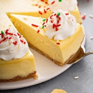 Cake server about to serve up a slice of sugar cookie cheesecake