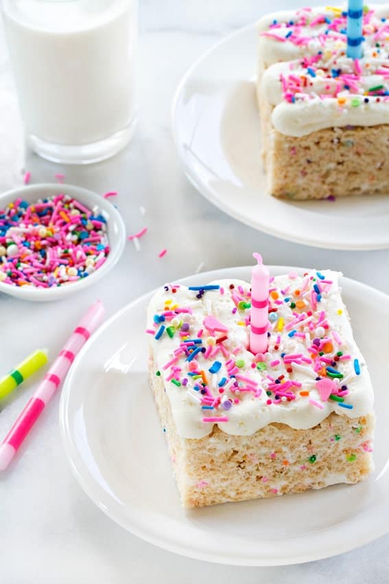 Birthday Marshmallow Cereal Treats are over-the-top in the best way possible! Gooey marshmallows, buttercream frosting and loads of sprinkles!