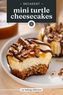 Mini turtle cheesecake on a white plate, with a bite taken from the cheesecake. Text overlay includes recipe name.
