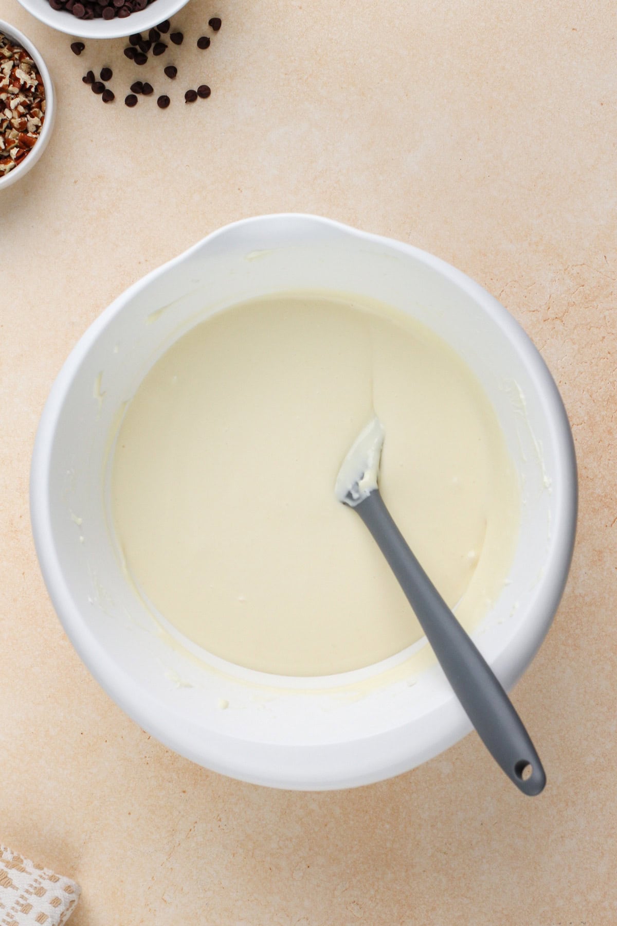 Cheesecake batter mixed in a white bowl.