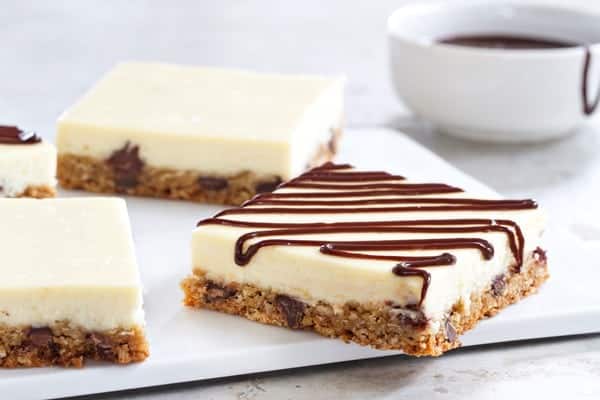 Oatmeal Chocolate Chip Cheesecake Bars have a delicious cookie crust that make them incredibly delicious! Your guests will be begging you for this recipe!