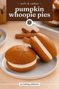 Two pumpkin whoopie pies arranged on a gray plate. Text overlay includes recipe name.