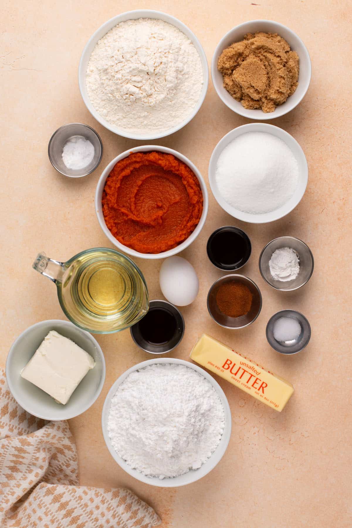Ingredients for pumpkin whoopie pies arranged on a countertop.