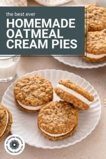 Two white plates filled with homemade oatmeal cream pies next to a glass of milk. Text overlay includes recipe name.