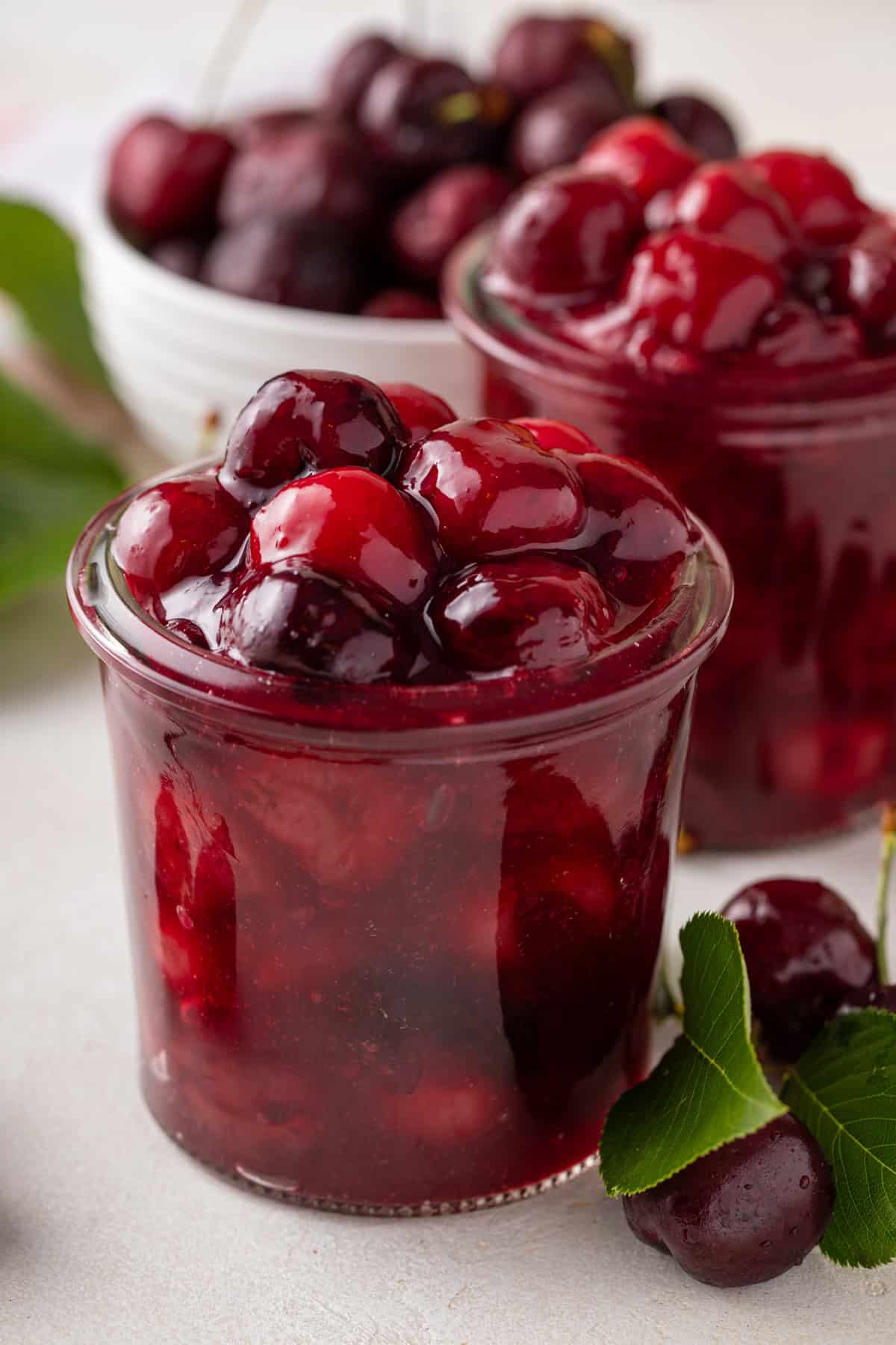 Close up of a jar of cherry pie filling.