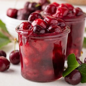 Jar filled with cherry pie filling.