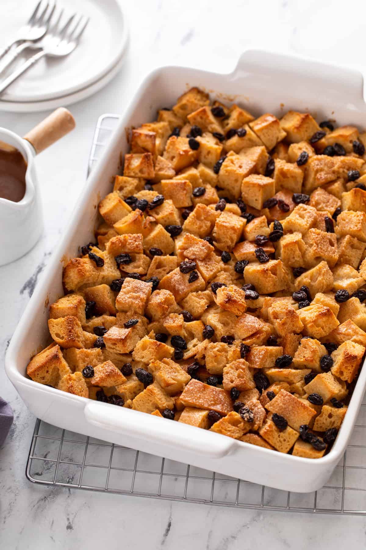 White baking dish filled with baked irish bread pudding.
