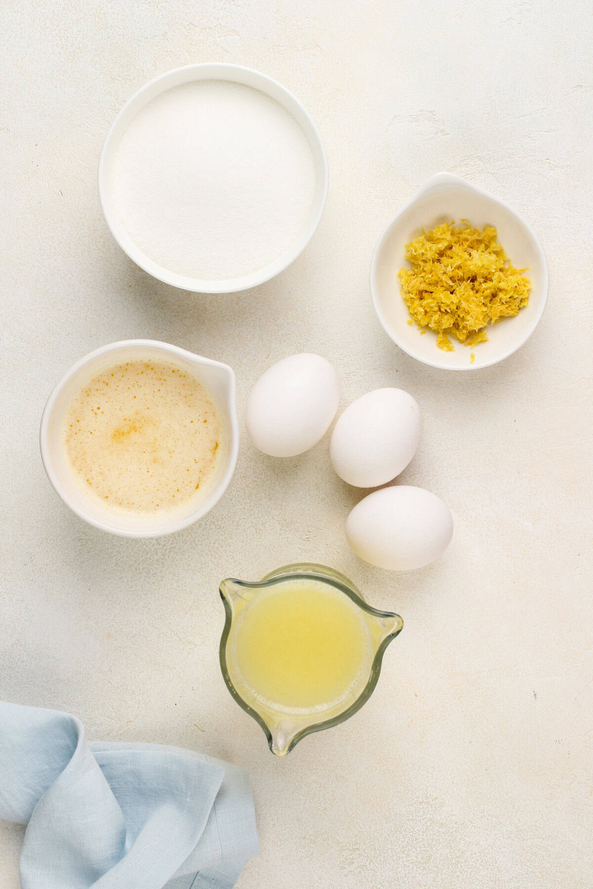 Microwave lemon curd ingredients arranged on a countertop.