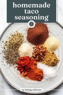 Spices for homemade taco seasoning arranged on a place. text overlay includes recipe name.