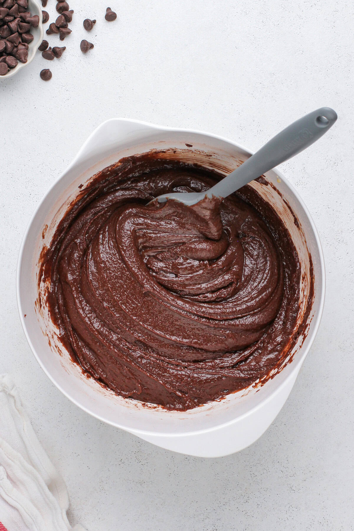 Chocolate muffin batter base mixed in a white bowl.
