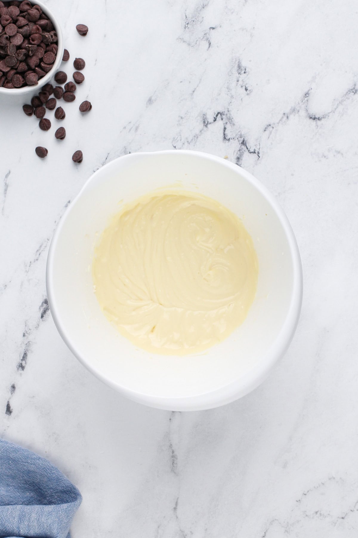 Cheesecake filling mixed in a white bowl.