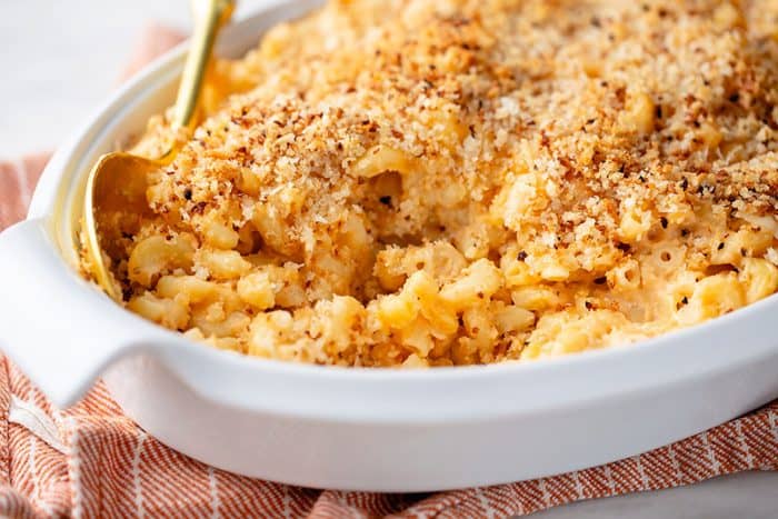 Close up of baked macaroni and cheese in a white casserole dish
