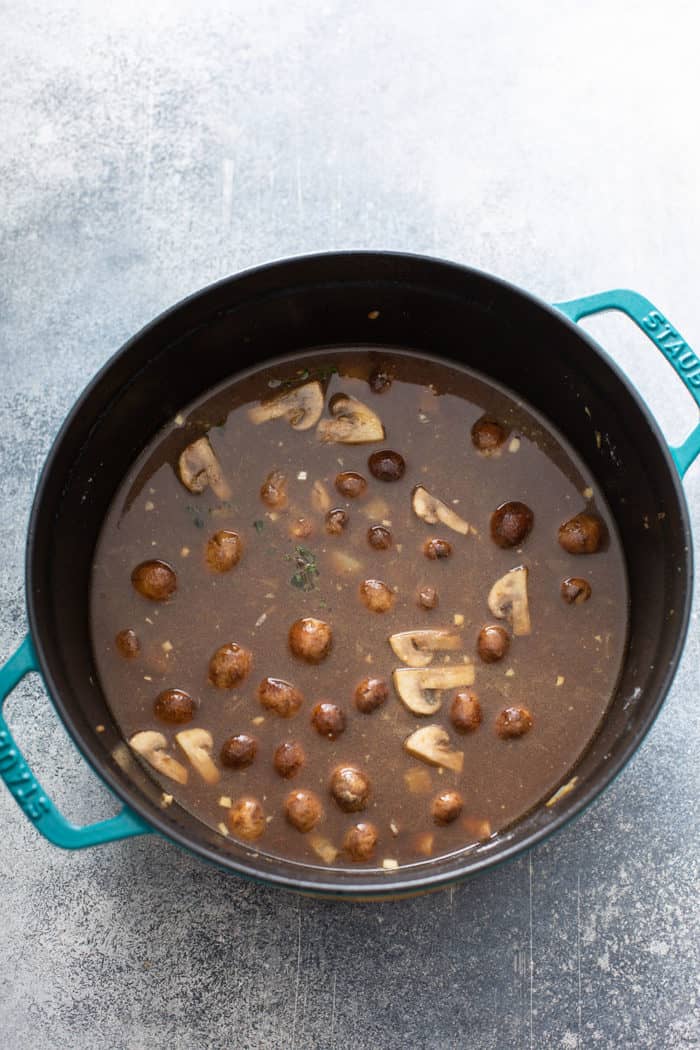 Stock base for one-pot beef stroganoff in a pot, ready for the noodles to be added