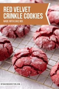 Close up of red velvet crinkle cookies on a wire cooling rack. Text overlay includes recipe name.