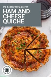Overhead view of a sliced ham and cheese quiche. Text overlay includes recipe name.