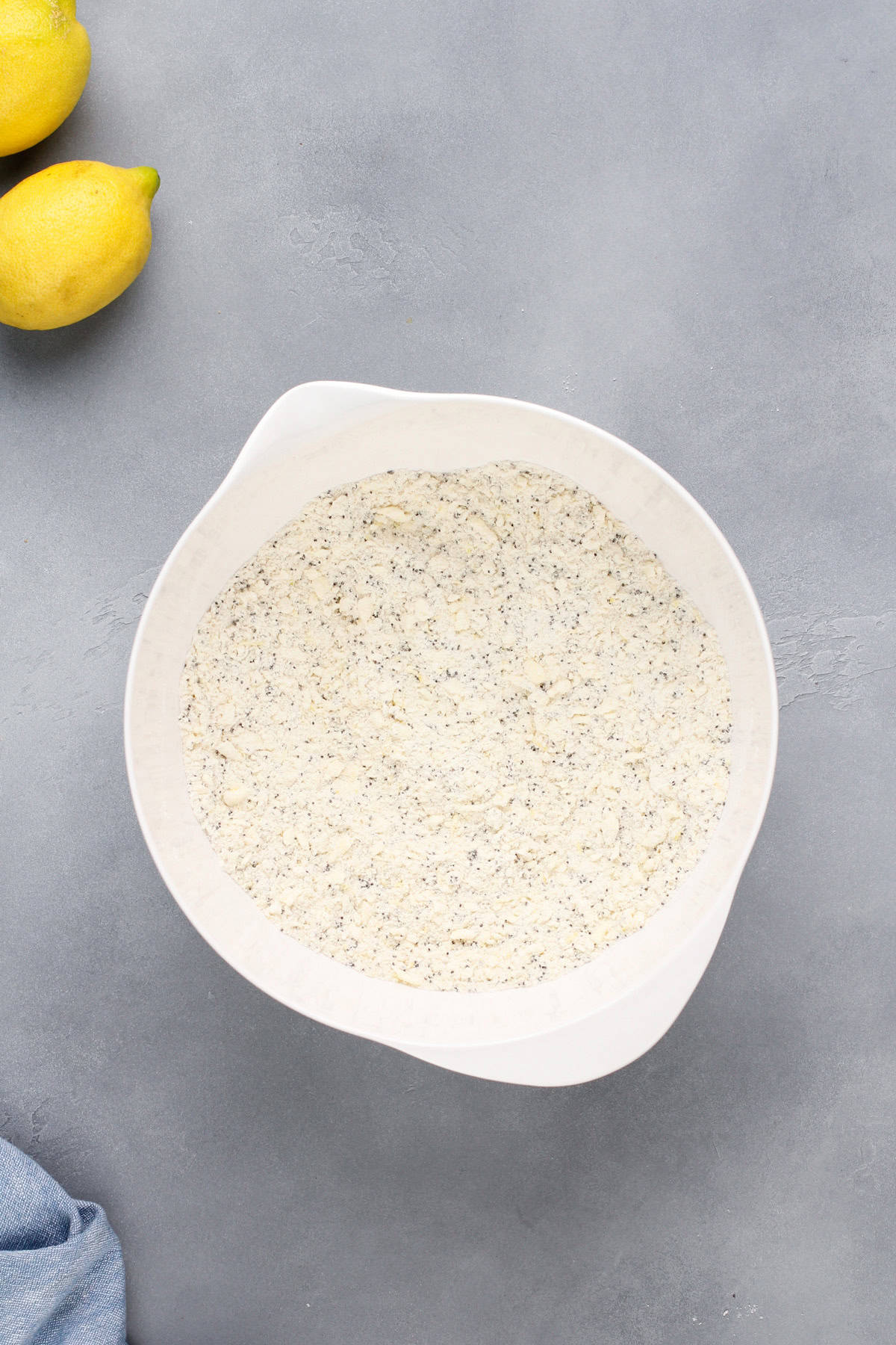 Butter worked into dry ingredients for lemon poppy seed scones.