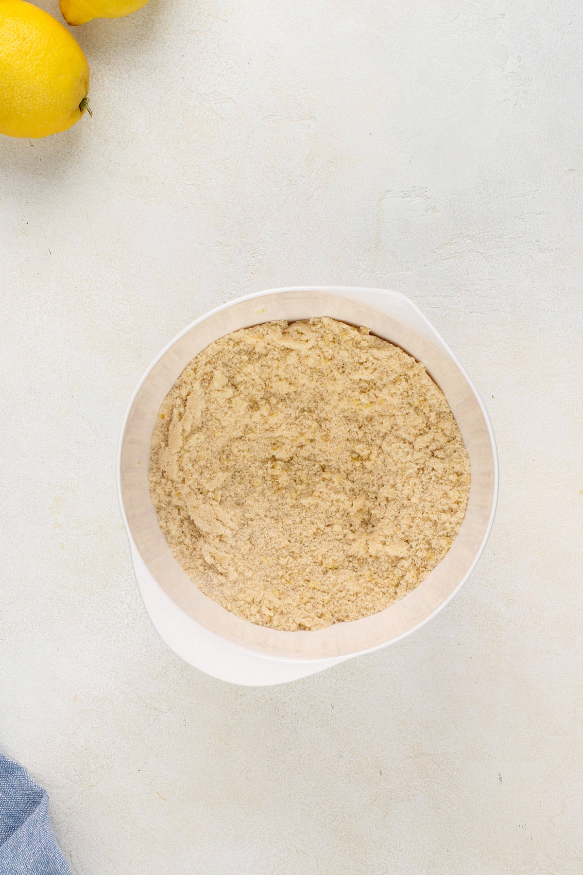 Granulated and brown sugars mixed with lemon zest in a small bowl.