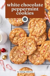 Overhead view of white chocolate peppermint cookies arranged on a wire rack. Text overlay includes recipe name.