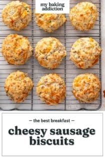 Cheesy sausage biscuits lined up on a wire cooling rack. Text overlay includes recipe name.